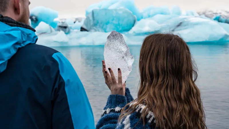 Icebergs drifting on a Jökulsárlón glacier lagoon boat tour in South East Iceland seen from the shore
